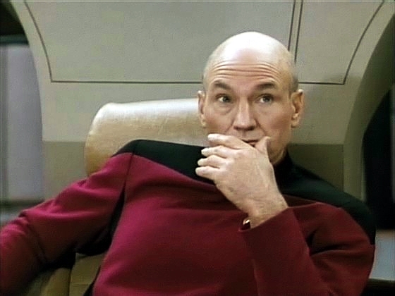Tvrdí, že Kontinuum ho vyloučilo, že je smrtelný a že si vybral podobu lidí. Kapitán Picard nevěří svým uším, když Q říká, že on - Picard - je nejblíž tomu, co by nazval přítelem.