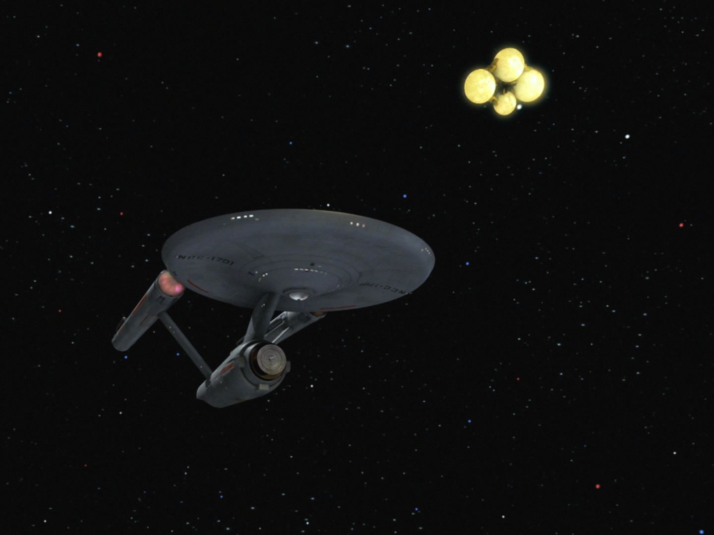 Z Fesaria ale přiletěla malá loď a vzala Enterprise do vleku. Posádka má být internována a Enterprise zničena. Až po značném úsilí se podaří odtrhnout se.