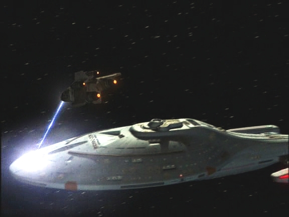 Na Voyager náhle zaútočila neznámá loď a způsobila výpadek energie. Vězni utekli a z cizí lodi se je poukoušejí odtransportovat. Jolegův bratr si pro něj přišel.