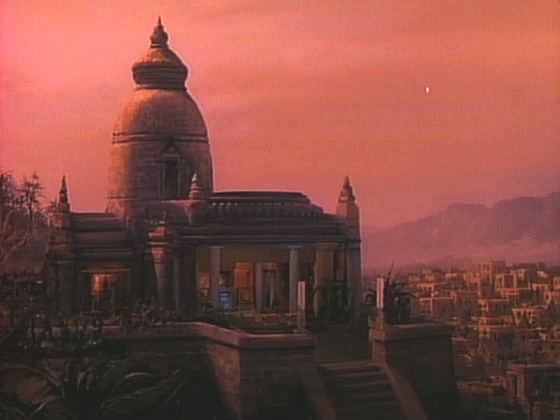 Pohled na Lutanův palác, kam je pozván kapitán a poradkyně Troi na slavnost. Kapitán musí Lutana požádat, aby Tashu vrátil.