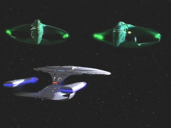 Nelvana III je zcela mrtvá planeta. Kapitán už ví, že Jarok i on padli do pasti. Když dá povel k návratu, odmaskují se náhle dva váleční ptáci a zablokují Enterprise cestu.