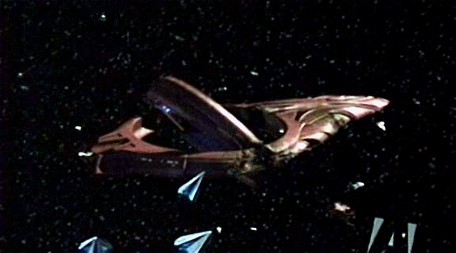 Vulkanská loď T'Kir, která by mohla pomoci, byla vážně poškozena Tholiany, kteří také hodlají loď z budoucnosti získat.
