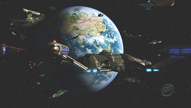 Enterprise je nejen na správném místě, ale i ve správném čase. Vrací se domů a naproti jí letí desítky pozemských vesmírných lodí.